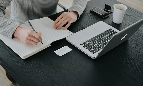 Business consultation meeting with strategy planning documents and competitive analysis charts